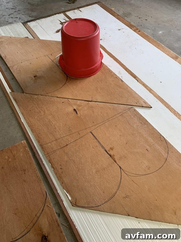 Sketching Halloween Decor Hand drawing a ghost silhouette onto a piece of old paneling