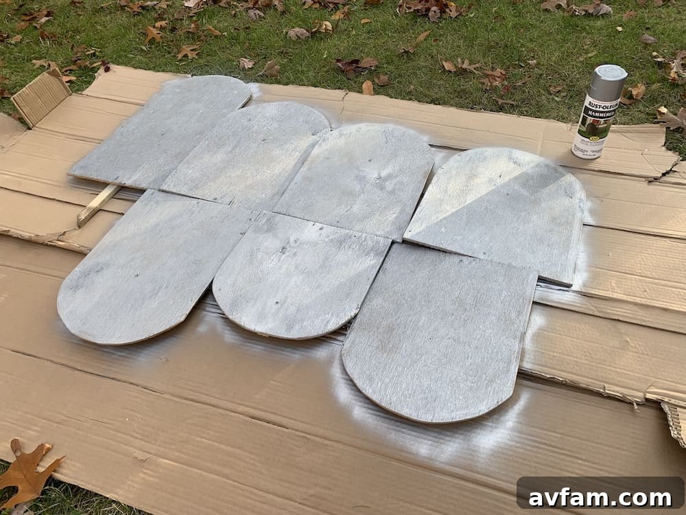 Completed Halloween Yard Display Finished DIY ghost and tombstone Halloween decorations in a yard