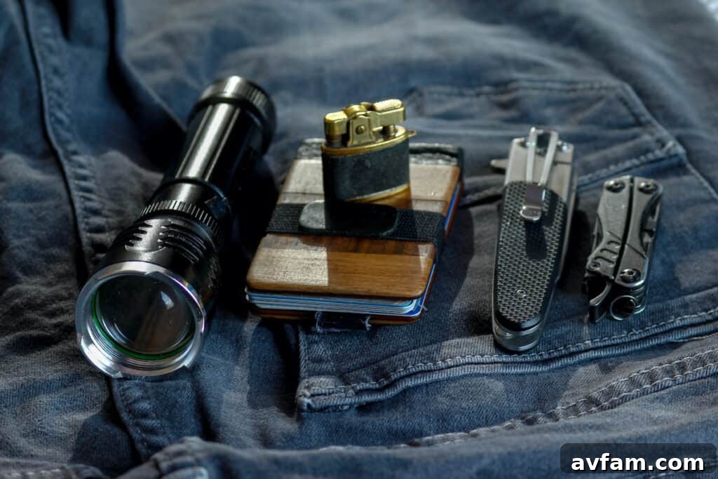 edc - everyday carry items include flashlight, lighter, wallet, knives, multitool, keys, and pen.