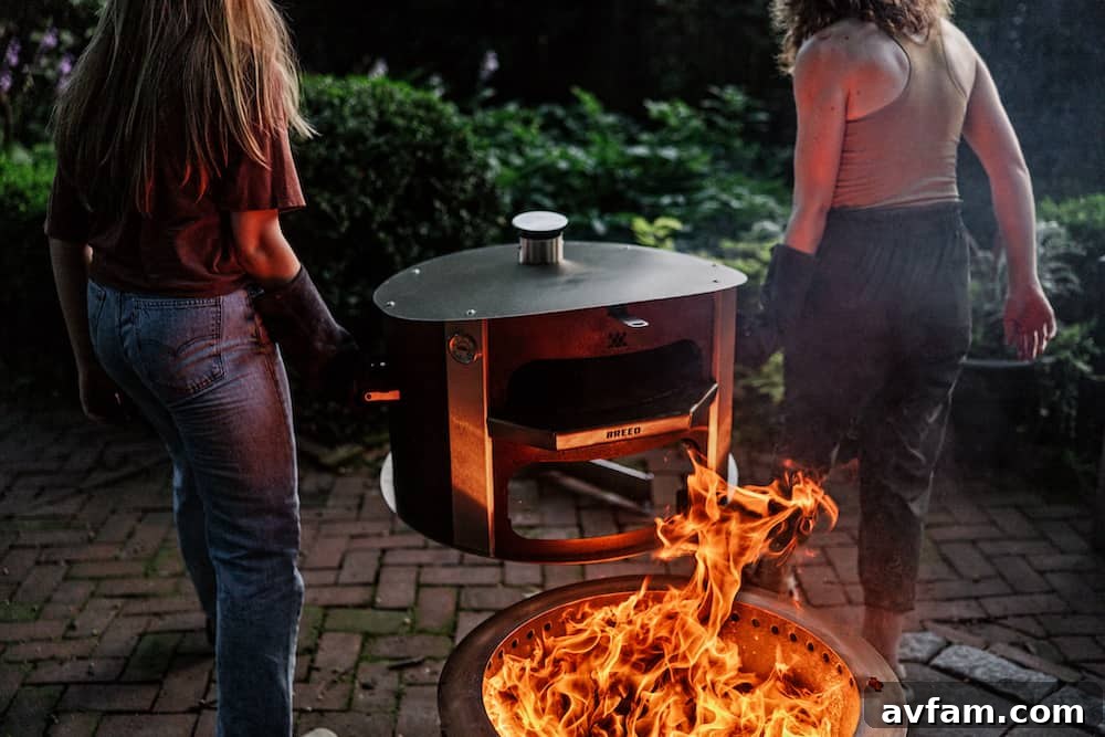 The Breeo X24 Smokeless Fire Pit creating a warm ambiance in an outdoor living space.