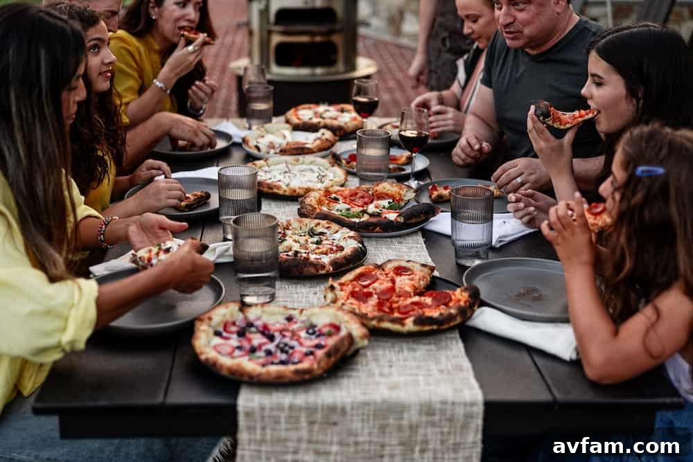 Close-up of a perfectly cooked pizza with bubbling cheese emerging from the Breeo Live-Fire Pizza Oven.
