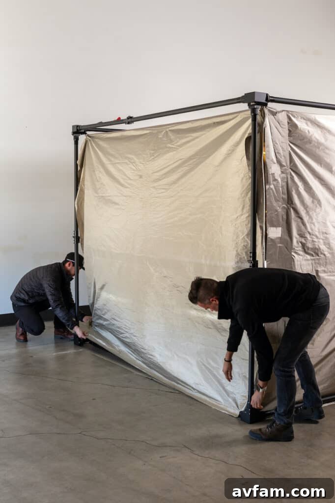 Front view of a vehicle secured by the CYBERCYLENT EMP Shielded Car Cover