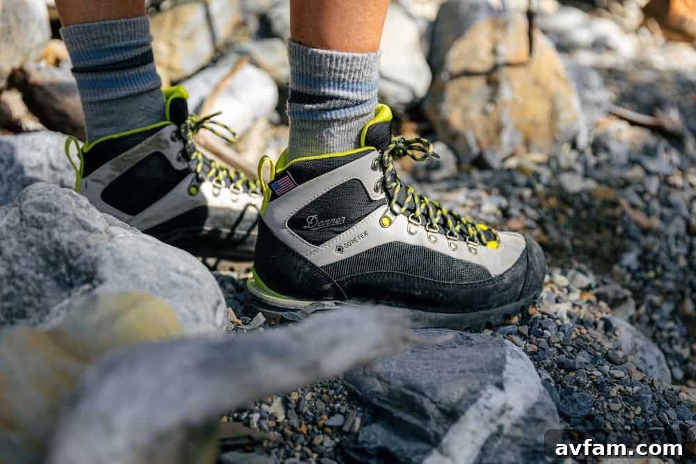 Side view of the Danner Crag Rat EVO against a blurred natural background.