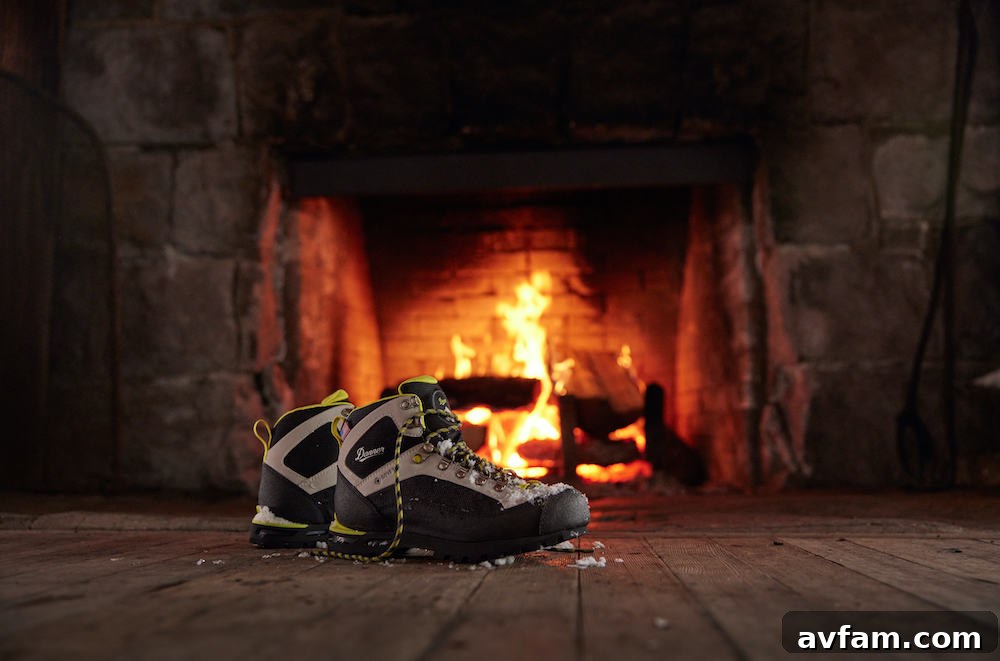 Danner Crag Rat EVO boots on a rocky outcrop, highlighting their sturdy construction.
