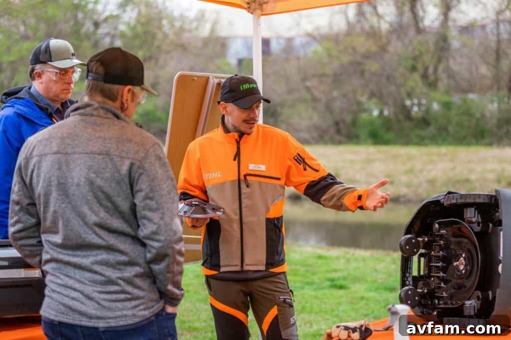 Louis Danet with iMOW Robotic Mower Product Segment Manager Louis Danet proudly showcasing Stihl's latest iMOW Robotic Mower, a glimpse into future lawn care.