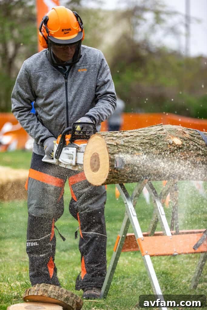 Glenn Hansen with MSA 300 M C-O Chainsaw Writer Glenn Hansen expertly demonstrating Stihl's powerful battery-powered MSA 300 M C-O Chainsaw, showcasing its cutting capabilities.
