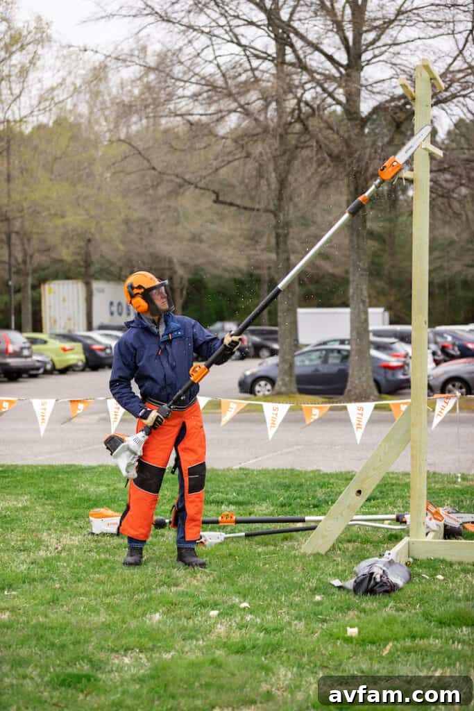 Stihl Blower Test Drive A participant trying out a Stihl battery-powered blower, assessing its power and comfort during a hands-on session.