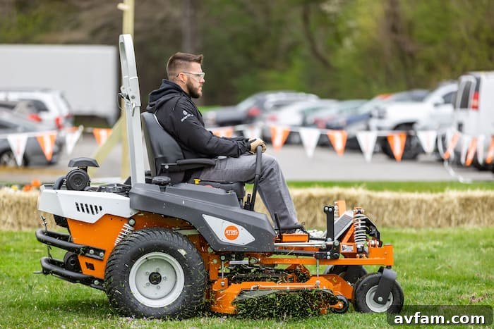 Stihl Mower Hands-On Participants engaging in a hands-on demo of Stihl battery-powered lawn mowers, assessing their performance and user experience.