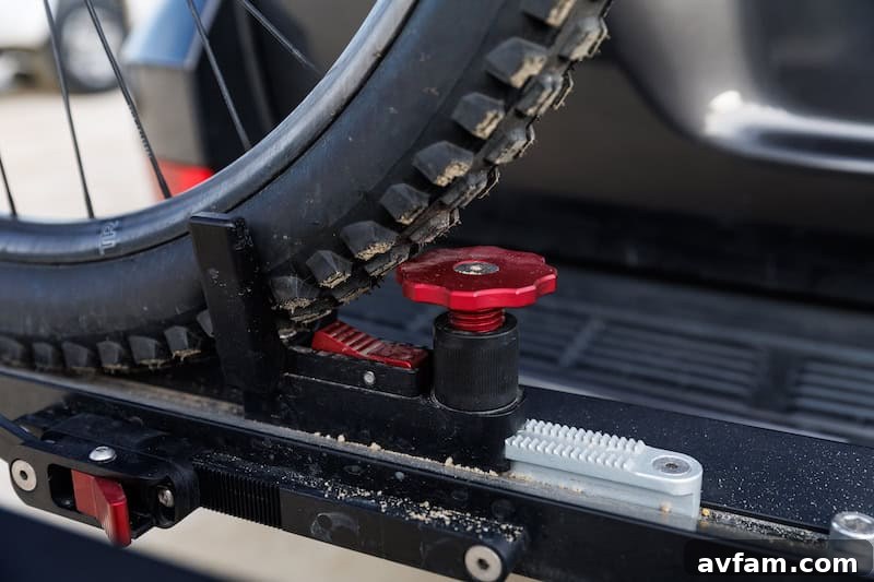 1UP USA Super Duty Hitch Rack folded compactly against a vehicle.