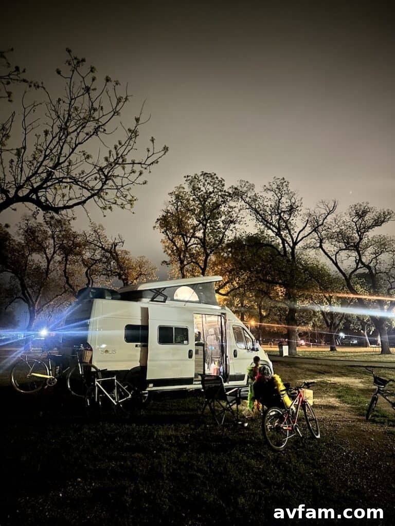 A family member relaxing and reading inside the Blacksford RV.