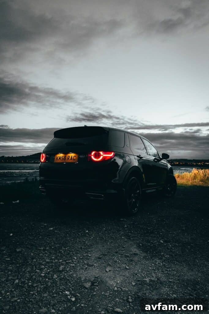No Pickup Required: 5 Off-Road Vehicles Ready for Any Adventure 4 Land Rover Discovery Sport traversing a challenging muddy path, showcasing its off-road prowess.