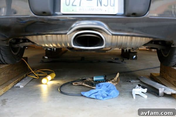 Essential Car Maintenance Tips Mechanic performing car maintenance on a modern vehicle