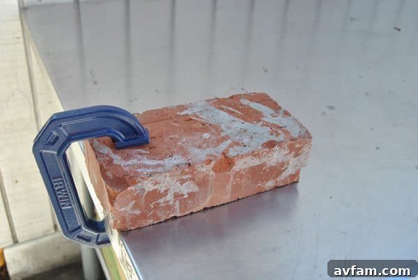Securely clamp the brick to a sturdy workbench for safety