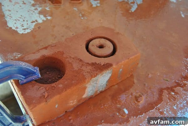 Flip the brick and repeat the drilling process from the other side
