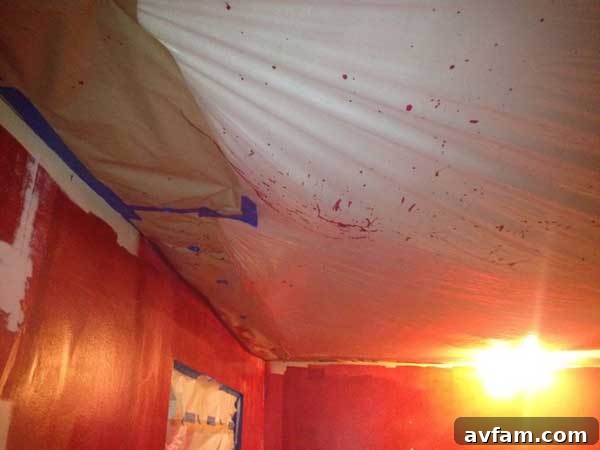 Uneven Red Paint Application Roller Marks Visible on Red Bedroom Wall