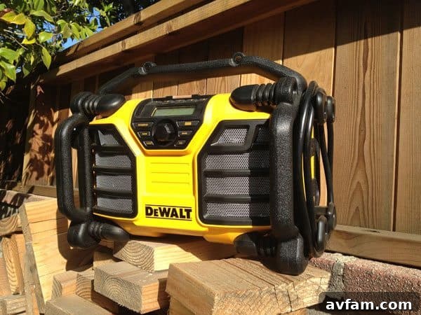DeWALT DCR015 Worksite Charger Radio on wood with tools