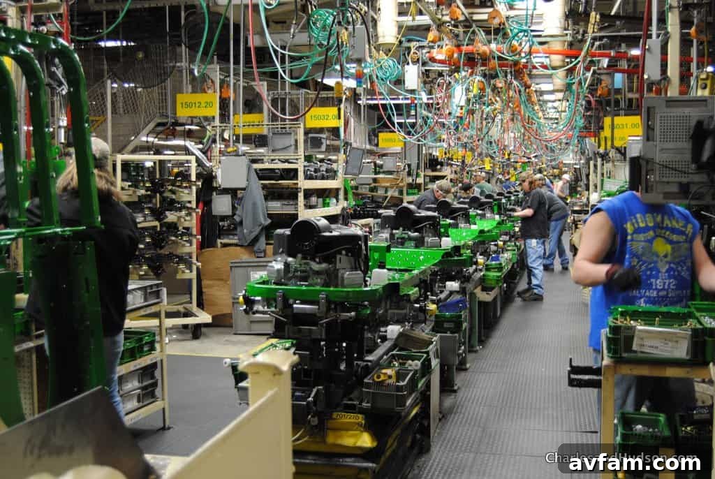 John Deere lawn tractors moving through a section of the assembly line