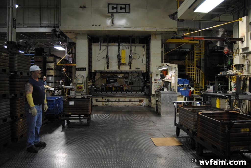 A vibrant display of John Deere parts ready for the next stage of production