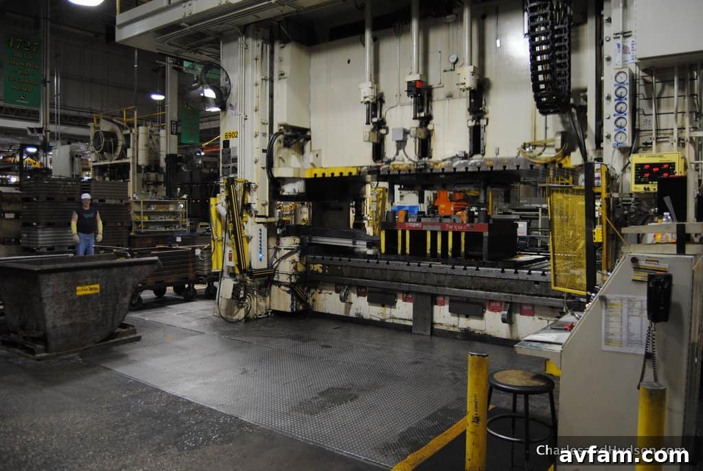 An operator expertly maneuvering equipment in the Horicon Works facility