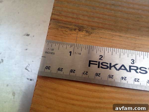 Measuring and marking a wood block with a ruler and pencil for precise planter design.