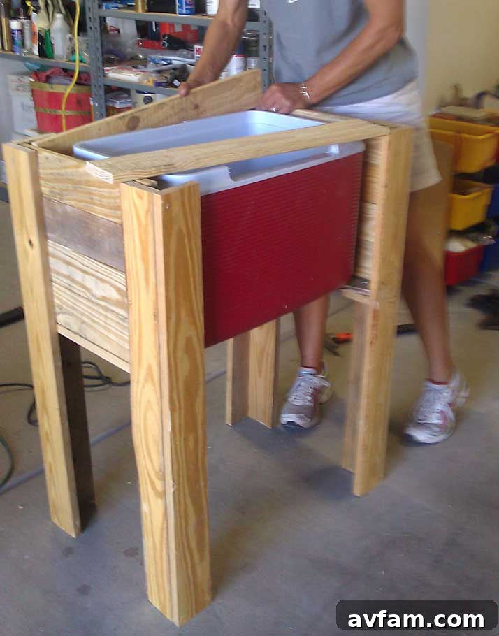 Sanding the Cooler Stand Sanding the finished pallet cooler stand for a smooth, splinter-free surface