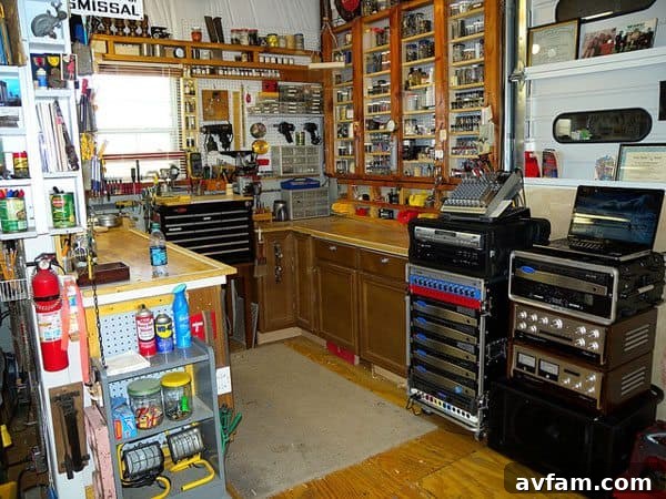 Rugged DeWALT portable entertainment system charging batteries in a garage.