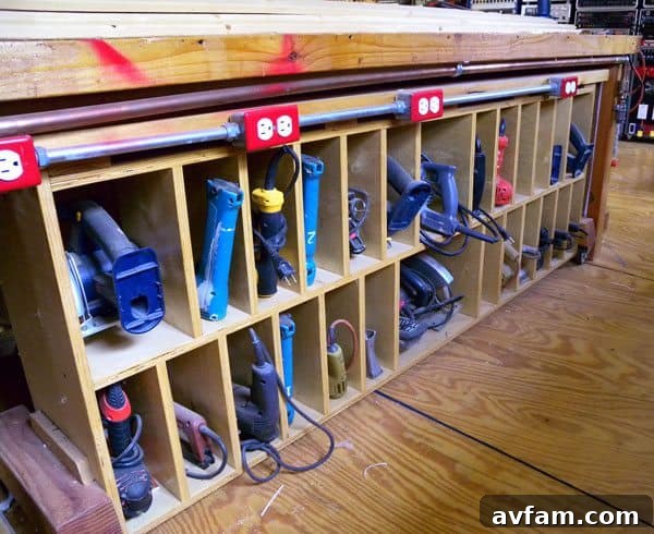 Variety of hand tools neatly organized on a pegboard in a garage workshop.