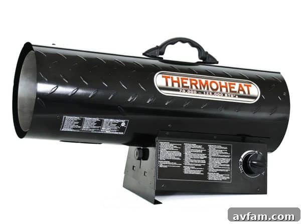 Propane floor heater providing warmth in a garage workshop setting.