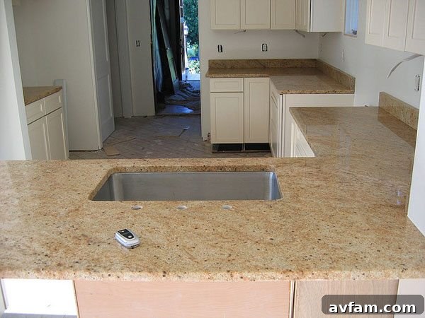 Elegant granite kitchen countertops featuring natural veins and patterns, suitable for various kitchen styles