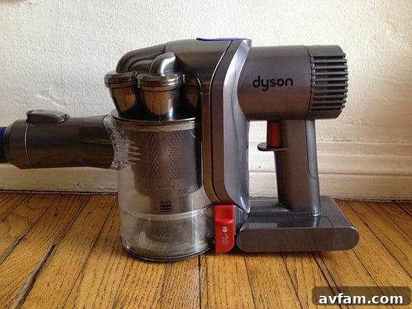 Dyson DC44 Animal ergonomic design Side view of the Dyson DC44 Animal showcasing its ergonomic handle and balance