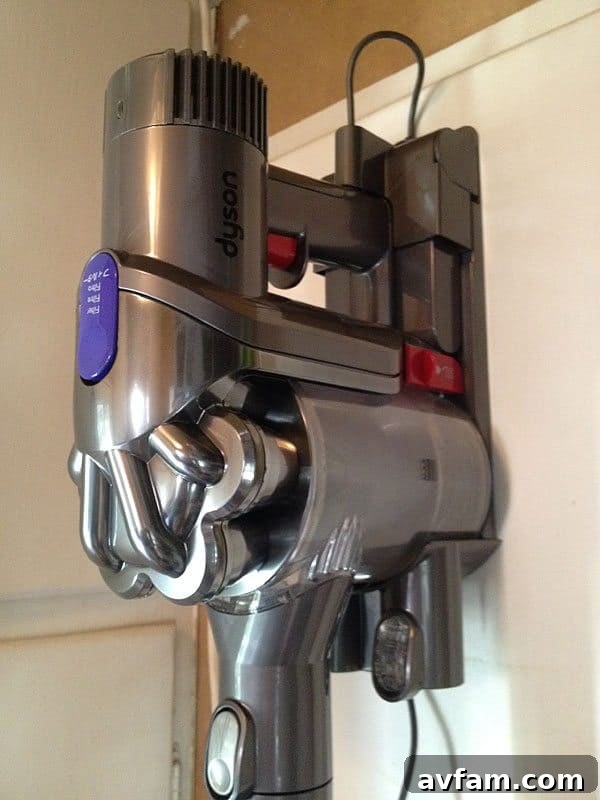 Dyson DC44 Animal charging dock Close-up of the Dyson DC44 Animal charging in its wall-mounted docking station