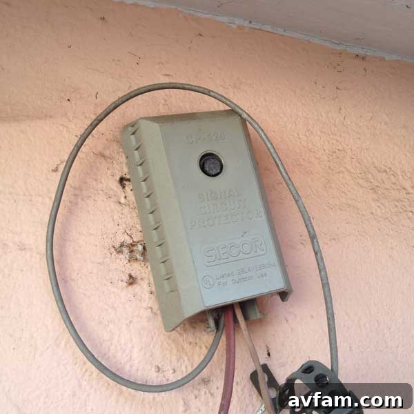 Old Surge Protector Old, non-functional telephone line surge protector on the garage wall, an eyesore to be removed.
