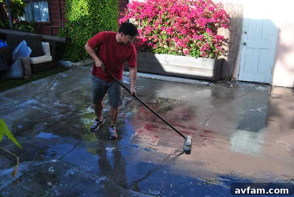 Rust-Oleum Brushing Scrubbing Concrete Patio with Rust-Oleum Cleaner