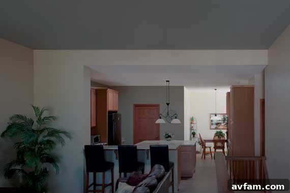 Dim dining area before Solatube installation with brown tones