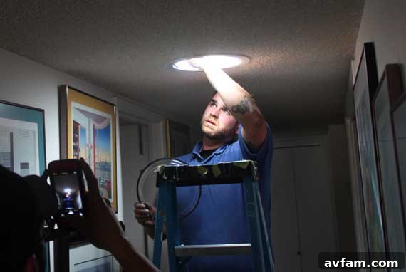 Hand reaching to connect Solatube components during installation