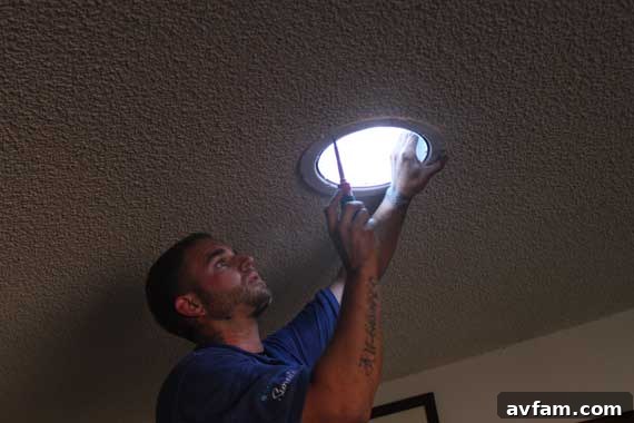 Solatube diffuser being installed into a ceiling