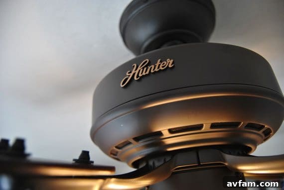 Hunter Caraway Five Minute Fan Close-up of a Hunter Caraway Five Minute Fan installed on a low ceiling, highlighting its elegant design and quiet efficiency.