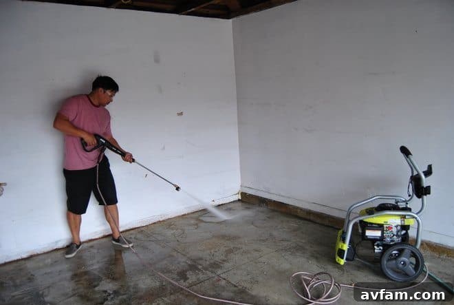 Power Washing Garage Floor During Epoxy Preparation
