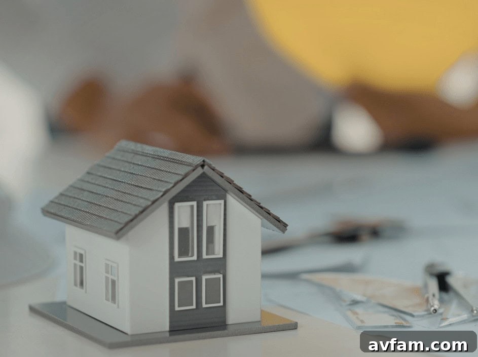 Renovation Budget Planning Detailed home renovation budget planning on a tablet with blueprints and financial documents