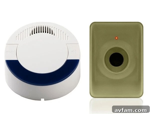 Two differently colored smoke detectors on a wall