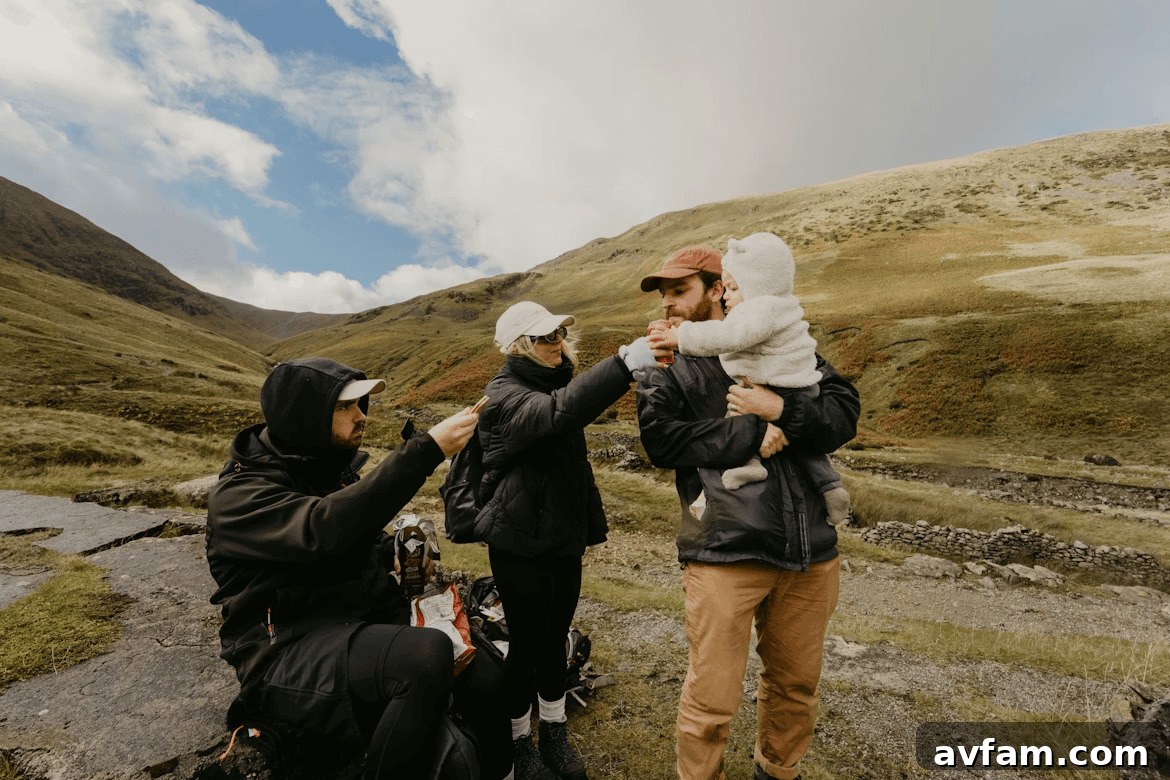 A family enjoys a panoramic view of Iceland's scenic landscape from their campervan, symbolizing the freedom and joy of a family road trip.