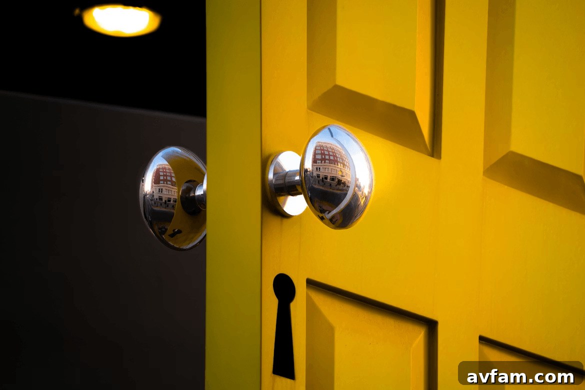 Close-up of a yellow door with two security