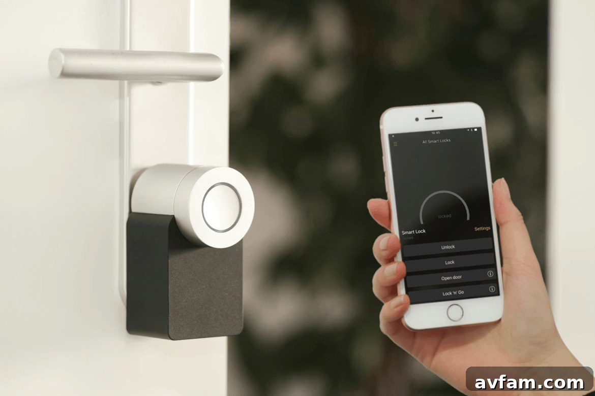 Person using smartphone to control smart home security door