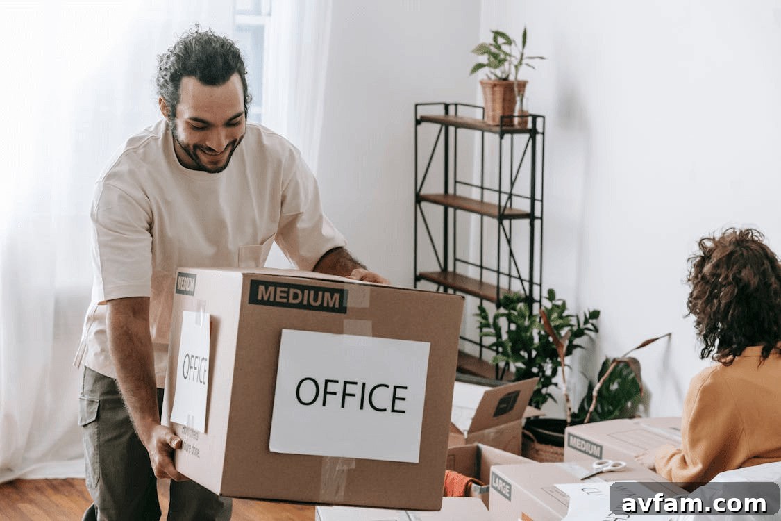 Man unpacking an office box during relocation