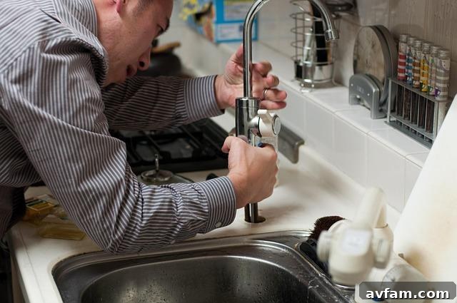 plumbing expert working on pipes