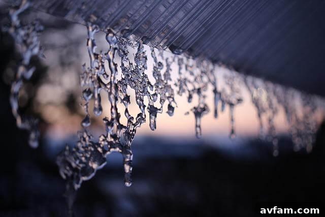 Water drops hanging from a roof, indicating a flashing