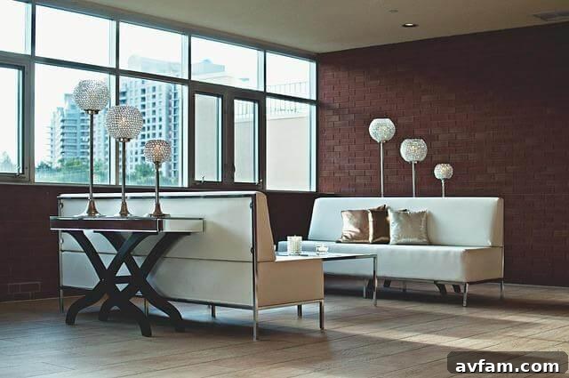 Stylish living room with modern furniture and large windows,