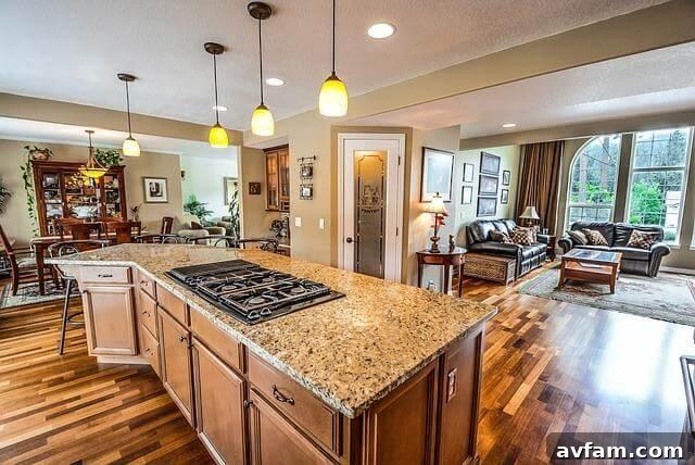 A kitchen with a stove top oven being inspected