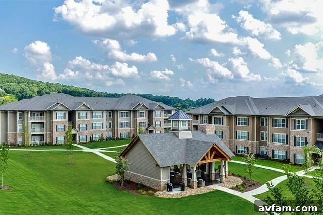 Apartment buildings in a green field, representing housing