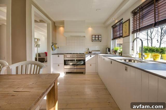 Modern kitchen with wooden table and white cabinets